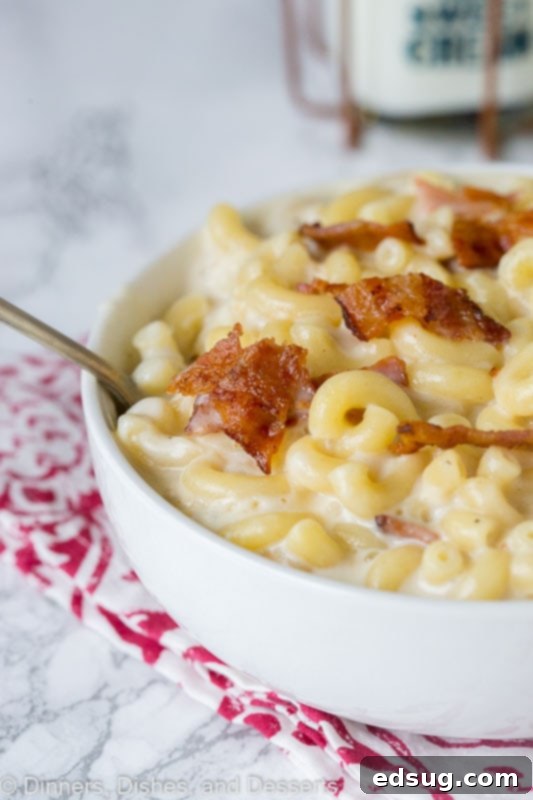 A close up of a mac and cheese with bacon
