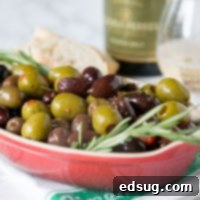 A bowl of olives and herbs