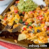 Loaded Sheet Pan Chicken Nachos 5 Sheet Pan Chicken Nachos - make a full tray of nachos for the whole family in minutes. Customize it to what your family likes, and get a dinner on the table, your family will love super fast!