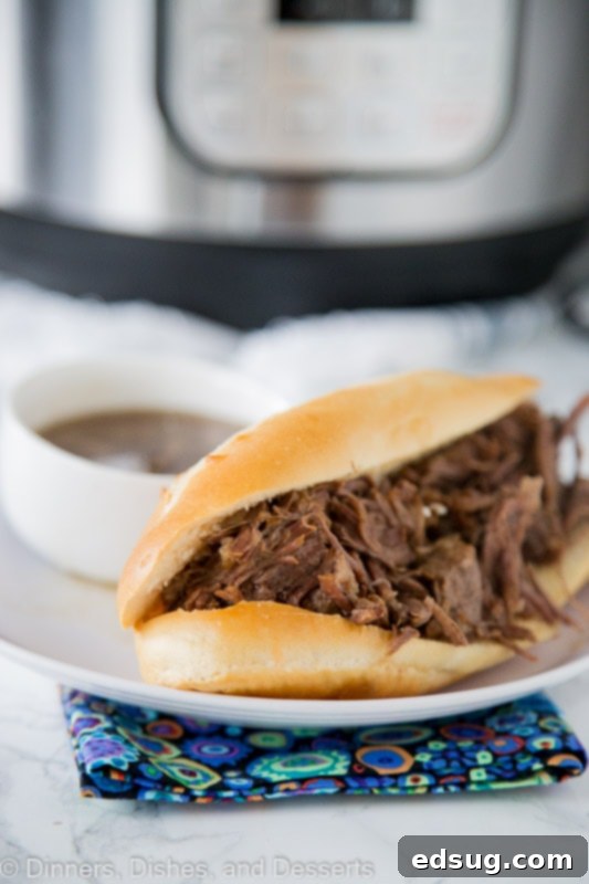 Melt-in-Your-Mouth Instant Pot French Dip Sandwiches 4 A close up of a sandwich on a plate