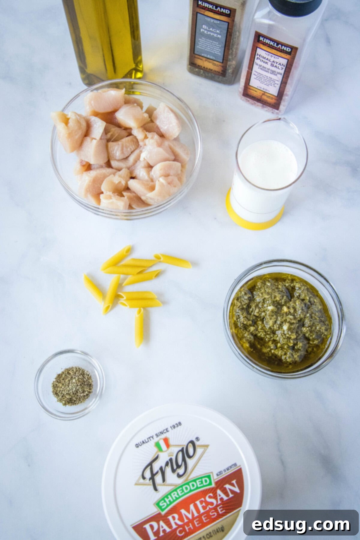 chicken pesto pasta ingredients laid out on a table