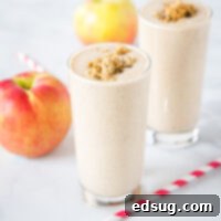 A vibrant and creamy apple cinnamon smoothie, garnished and ready to be enjoyed as a healthy meal.