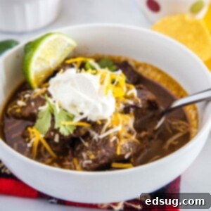 Authentic Texas Chili 7 cropped image of beef chili topped with cheese and sour cream