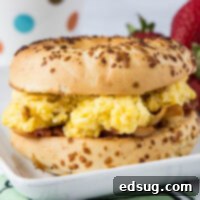 Savory Morning Stack 1 An egg and bacon bagel sandwich on a plate