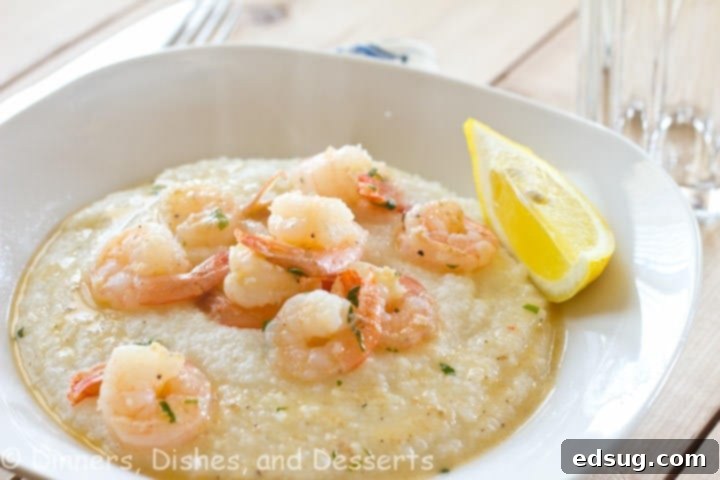 Lemon Garlic Shrimp and Grits, a light and delicious lemony shrimp served over buttery and cheesy grits.