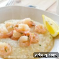 Lemon Garlic Shrimp & Grits, presented beautifully in a bowl, ready to be enjoyed.