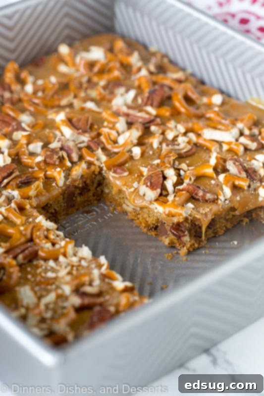 An entire pan of freshly made Butter Pecan Pretzel Bars, ready for slicing.