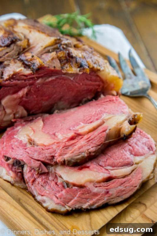 A beautifully cooked prime rib roast, ready to be sliced, perfect for holiday gatherings.