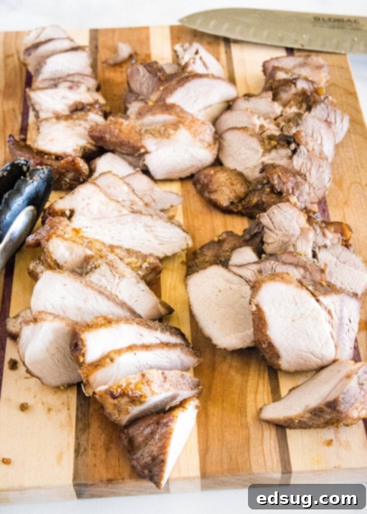 This easy char siu pork recipe is tender, juicy, and loaded with your favorite Chinese flavors like hoisin and five-spice powder.  A cutting board filled with pieces of char siu pork