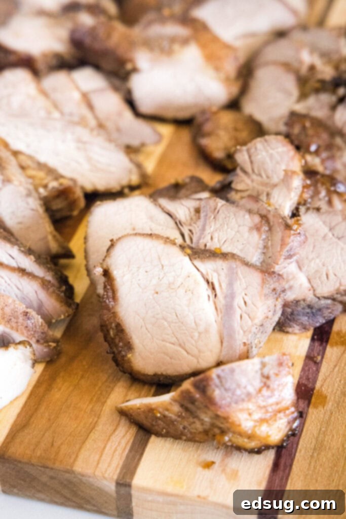This easy char siu pork recipe is tender, juicy, and loaded with your favorite Chinese flavors like hoisin and five-spice powder.  Close up of cut pieces of char siu pork