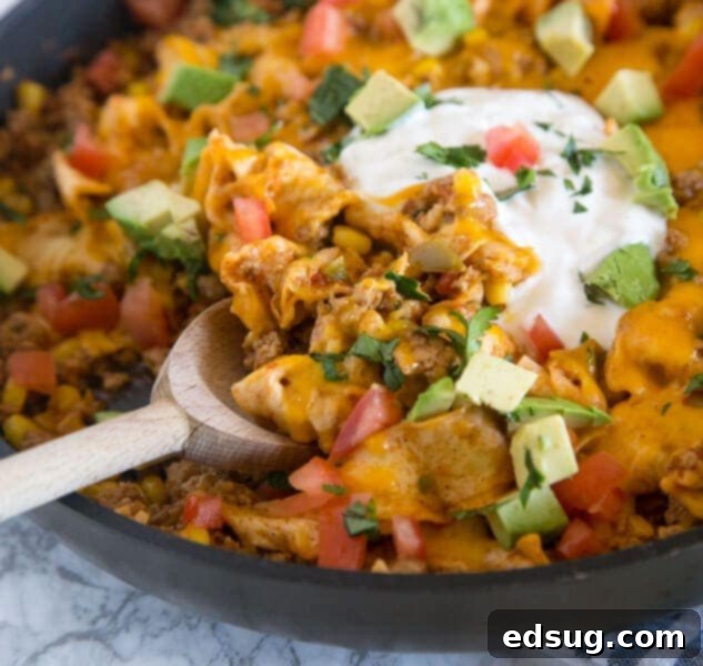 A hearty Beef Burrito Skillet, a one-pan meal resembling a deconstructed beef burrito, garnished with fresh cilantro.