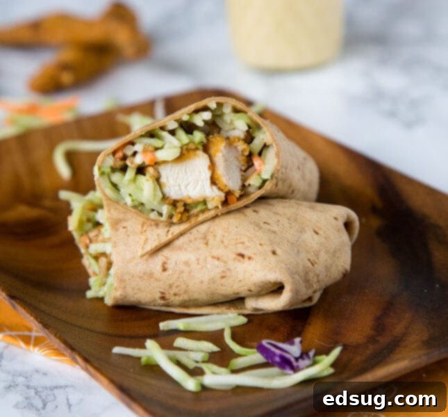 Honey Sesame Chicken Salad Wraps, featuring crispy chicken and broccoli slaw in a creamy dressing.