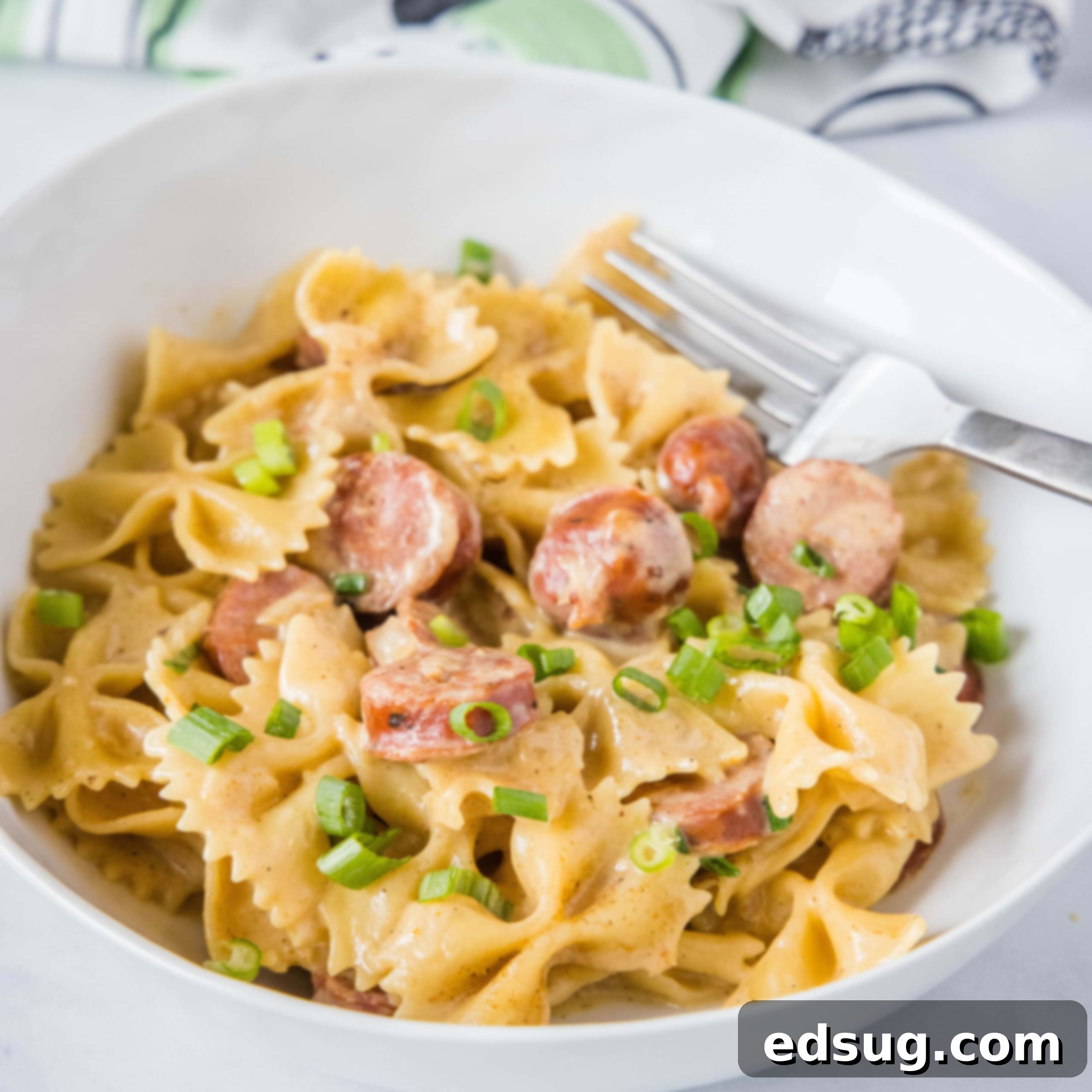 cropped in close up of cajun pasta skillet in a white bowl