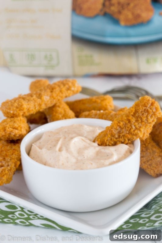 Cajun Kick Dipping Sauce 2 Creamy Cajun dip in a bowl with crispy fish sticks, ready for dipping