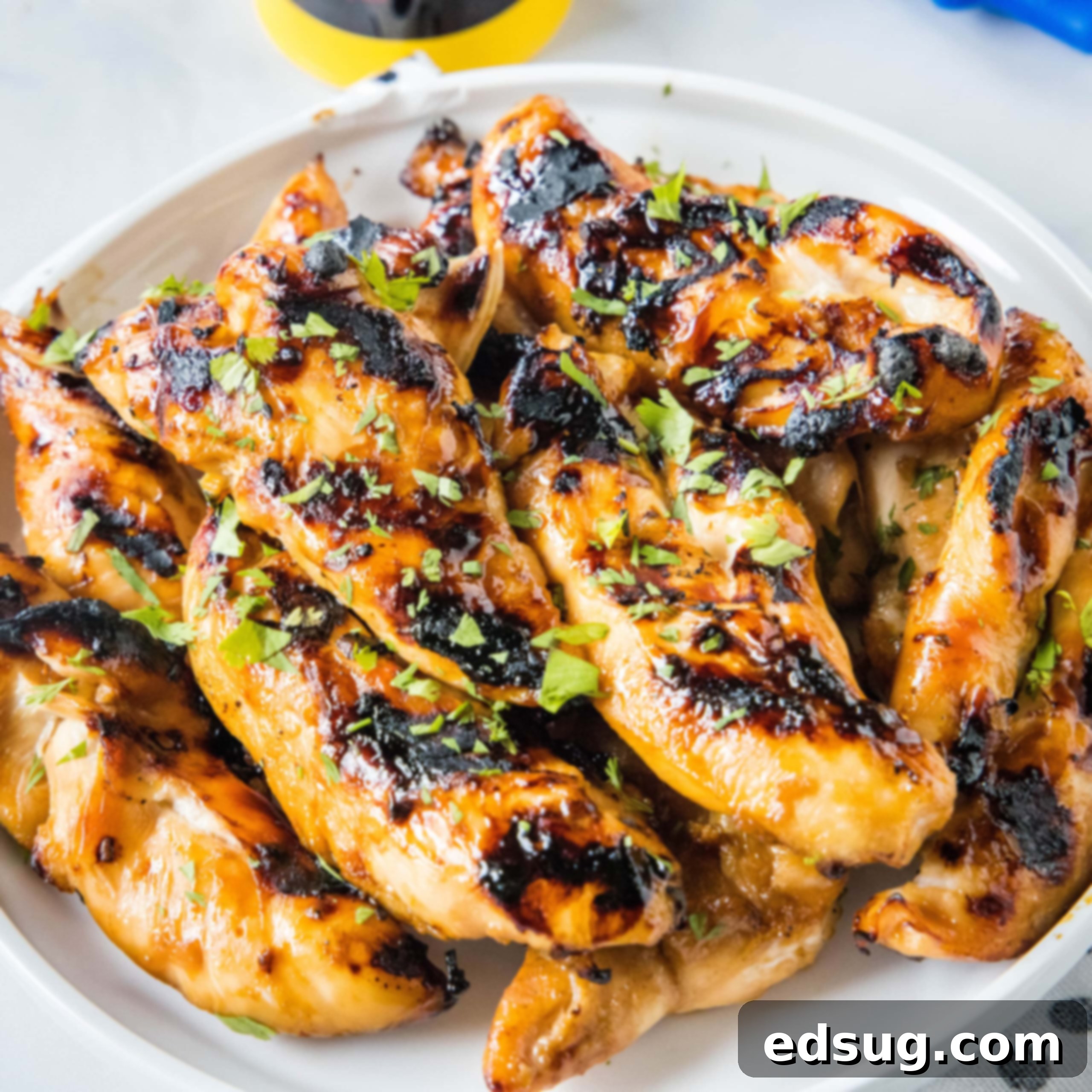 Cluck-Worthy Chicken Meals 19 Teriyaki grilled chicken piled on a white platter.