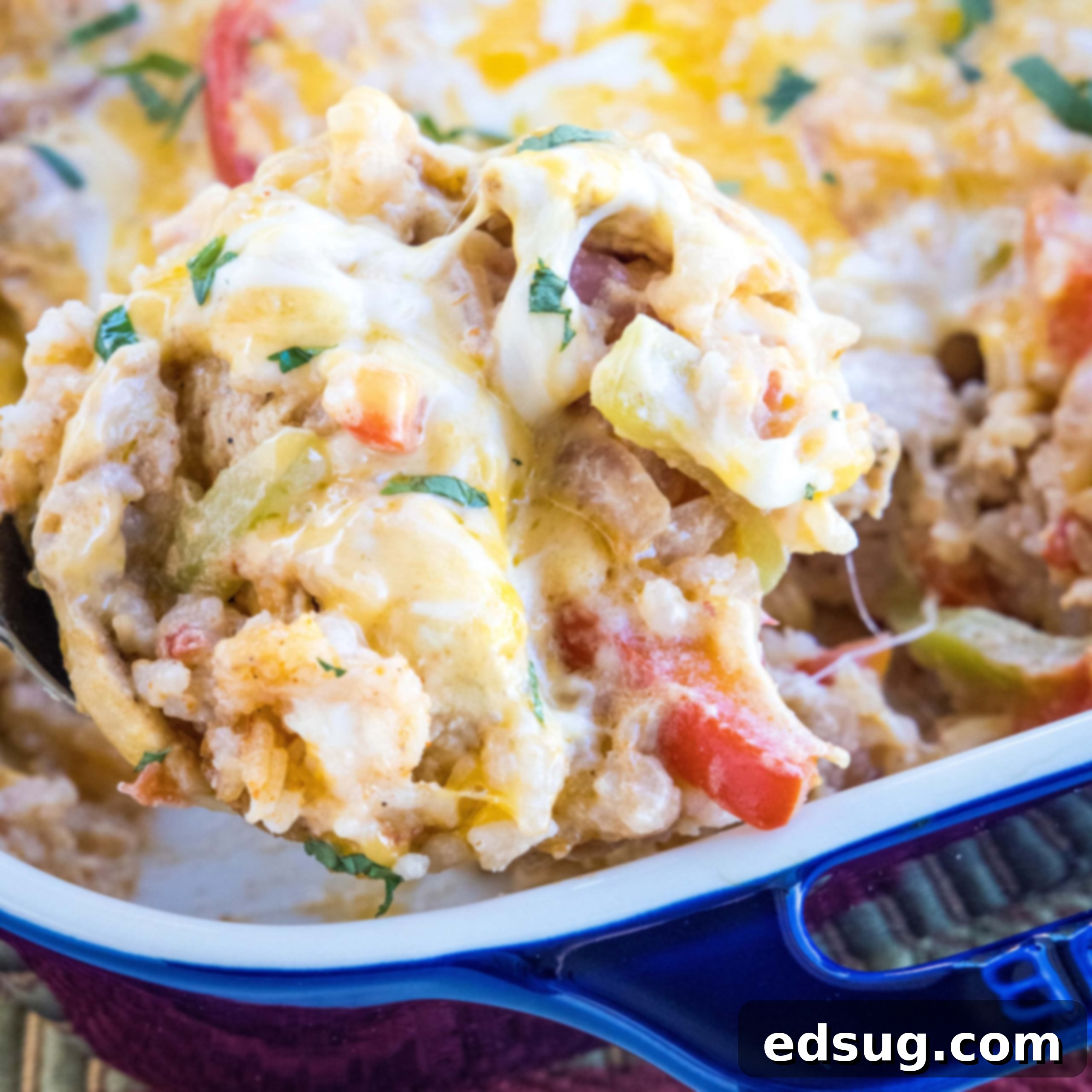 Cluck-Worthy Chicken Meals 4 A serving of chicken fajita casserole being scooped from a baking dish.