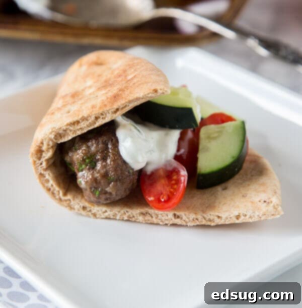 Sheet Pan Greek Meatballs - Greek flavored meatballs make for an easy dinner. Serve with tzatziki sauce for dipping and pitas to make gyros.