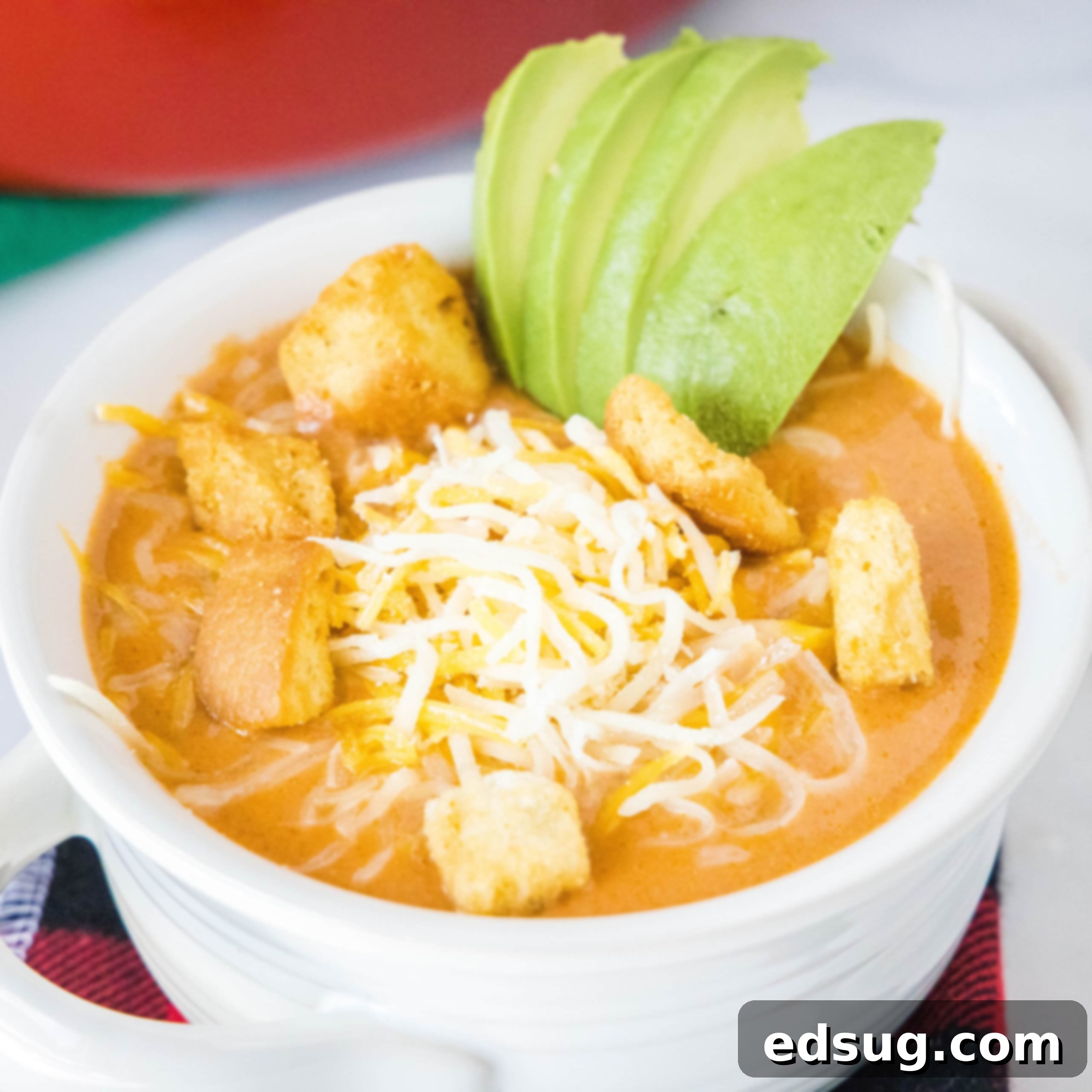 close up cheeseburger soup in a white bowl