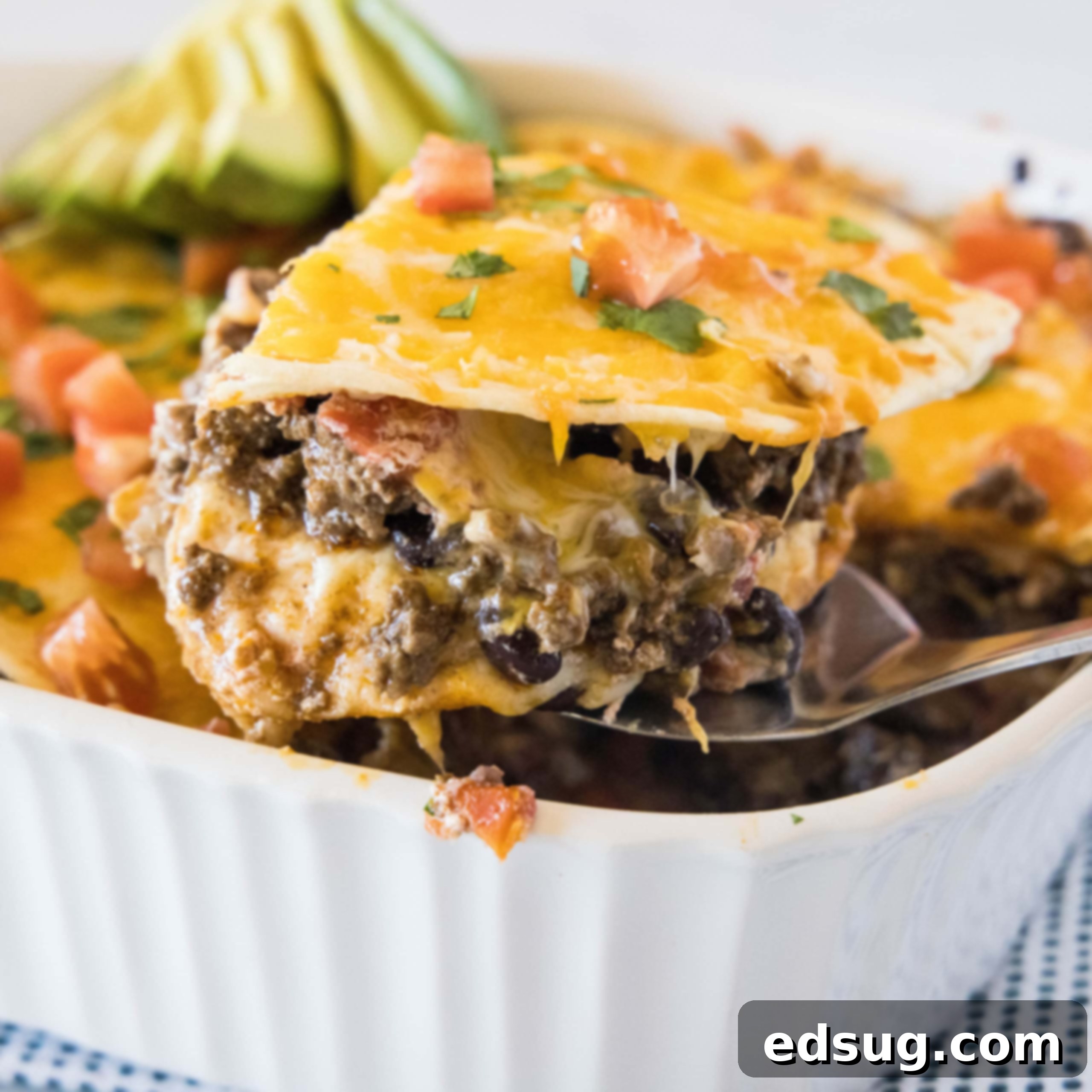 close up slice of burrito casserole on a spatula
