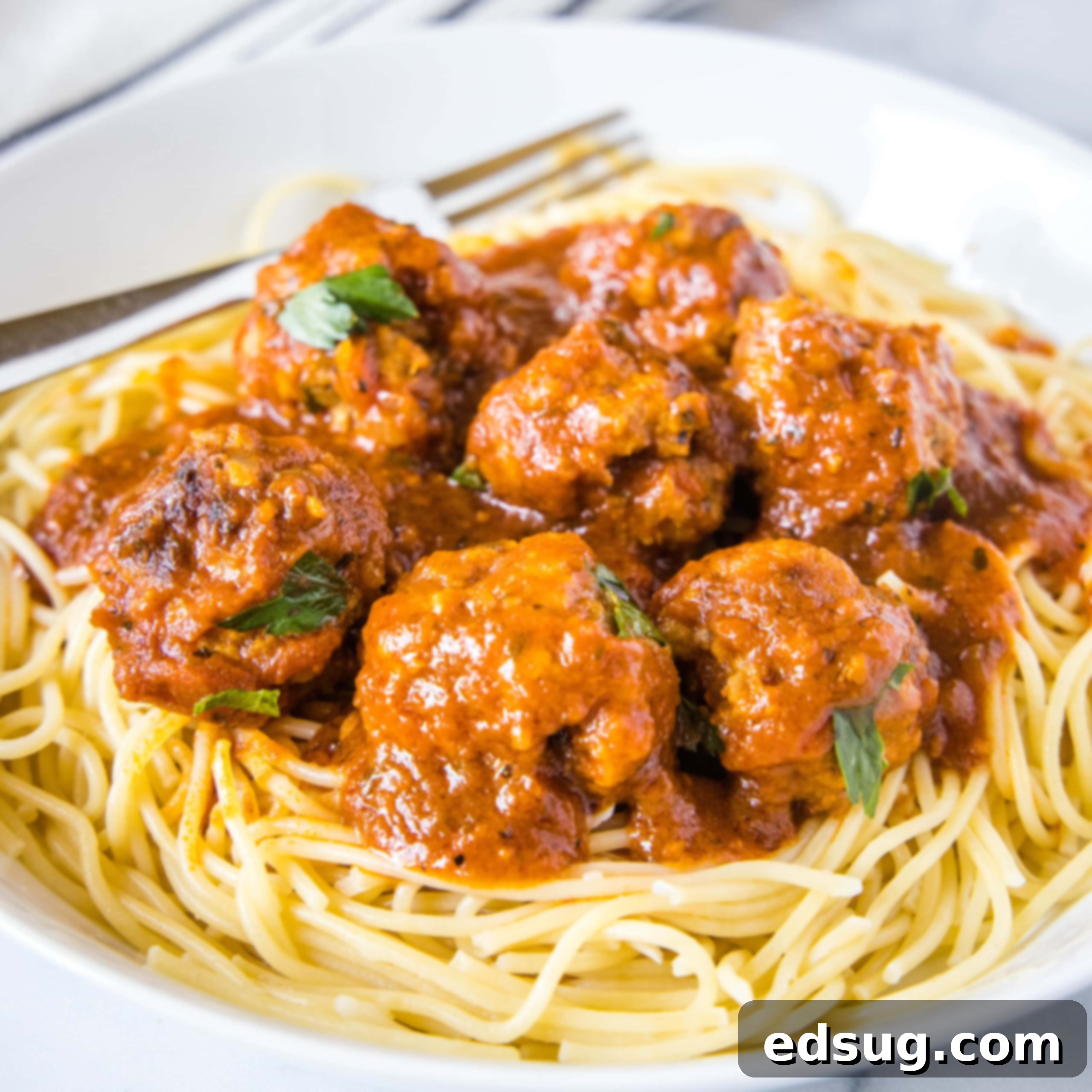 close up meatballs on spaghetti