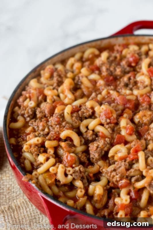 A red dutch oven full of goulash