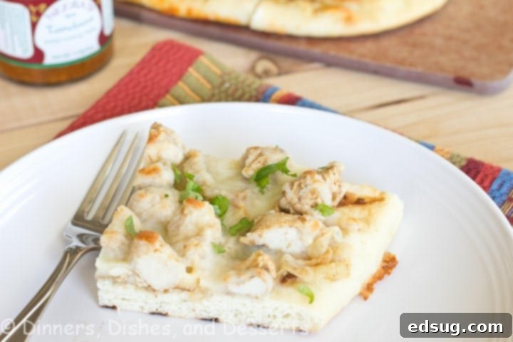 Tandoori Chicken Naan Pizza Delicious Tandoori Chicken Naan Pizza on a cutting board