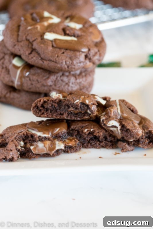 Andes mint stuffed cake mix cookies on a baking sheet, freshly baked and still warm.