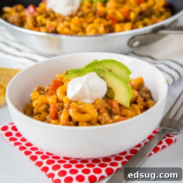 Taco Pasta Skillet - All the flavors of taco night in a one pan meal, ready in 20 minutes! Homemade version of taco Hamburger Helper, with just a few staple ingredients.