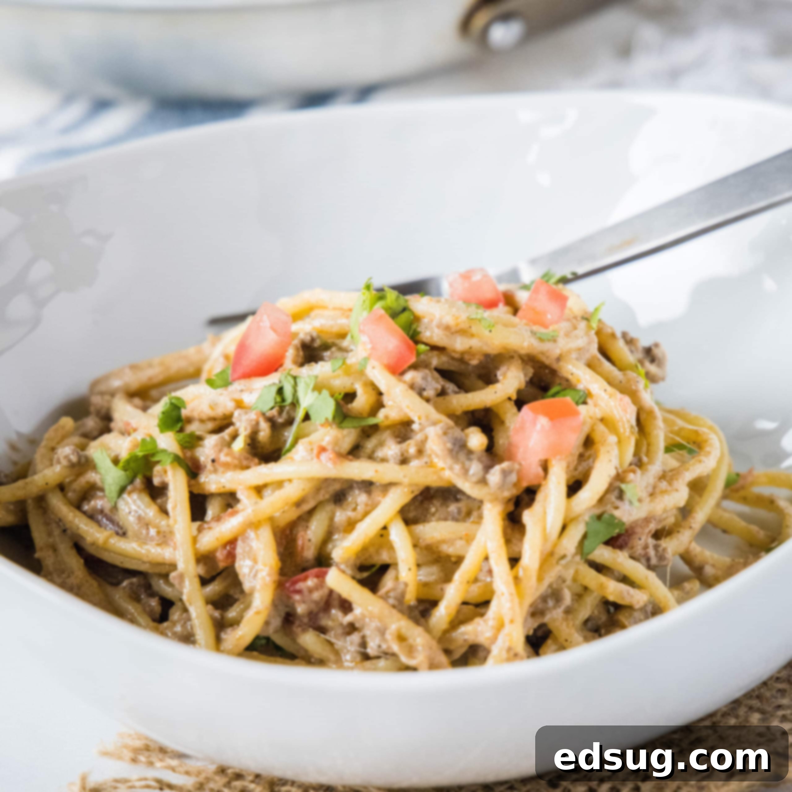 close up of taco spaghetti in a white bowl