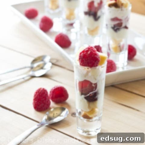 Classic English Trifle with layers of cake, jam, custard, and cream, beautifully presented