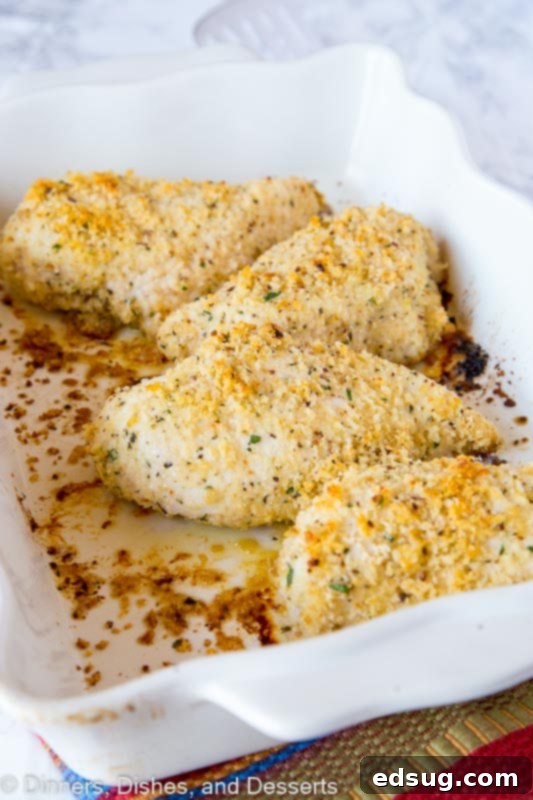Garlic Baked Chicken Recipe - Crispy oven baked chicken coated with plenty of garlic. Ready in minutes and the whole family will love it! Crispy garlic baked chicken in white dish
