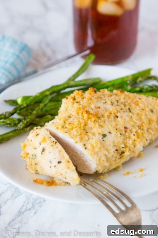 Garlic Baked Chicken Recipe - Crispy oven baked chicken coated with plenty of garlic. Ready in minutes and the whole family will love it! Garlic lovers baked chicken sliced