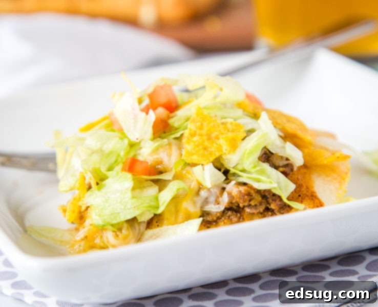 A hearty and delicious plate of taco pizza, garnished and ready for a family meal.