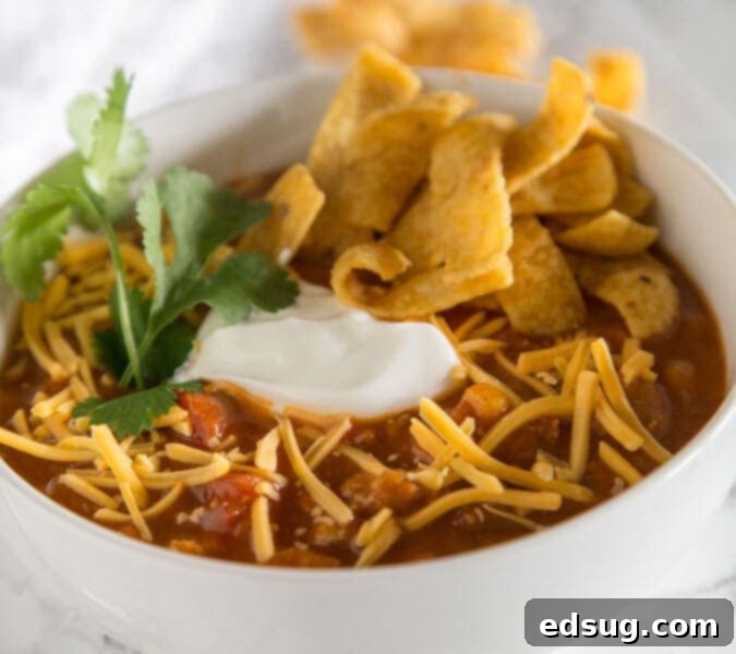 Easy Taco Soup - a hearty and comforting taco flavored soup that is ready in minutes. Top with your favorite toppings to make it even better!