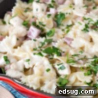 pasta with diced ham in a skillet