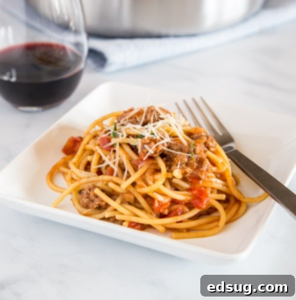 One Pot Spaghetti with Meat Sauce, perfectly cooked and served in a square dish.