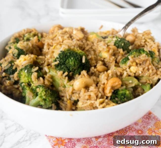 Nutty fried rice with cashews and vegetables in a bowl, ready to serve.