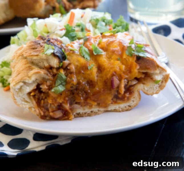 Barbecue Chicken Stuffed French Bread on a plate, showing the delicious filling.