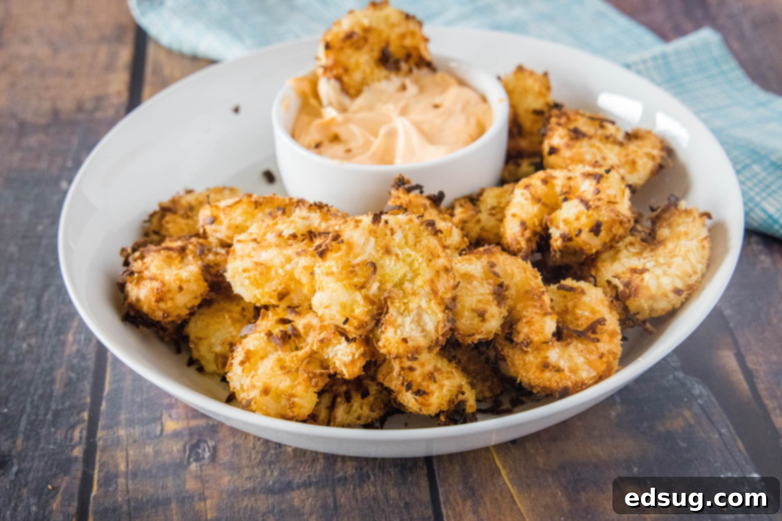 Crispy Air Fryer Coconut Shrimp, sweet and delicious, served with a dipping sauce.