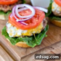 The Ultimate Turkey Burger 4 A close up of a burger on a cutting board