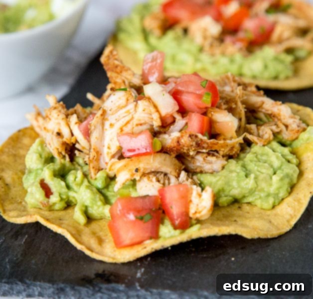 Crispy Chicken Tostadas topped with guacamole and salsa