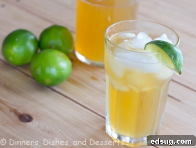 Swanky Cayman Lemonade, a delightful Caribbean limeade made with brown sugar and honey, served over ice.