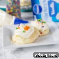 Sparkle-Topped Funfetti Cake Mix Cookies 7 Frosted Funfetti Cake Mix Cookies - super easy and soft funfetti cookies topped with a swirl of vanilla frosting and more sprinkles.  These cake mix cookies come together in minutes and are sure to impress!