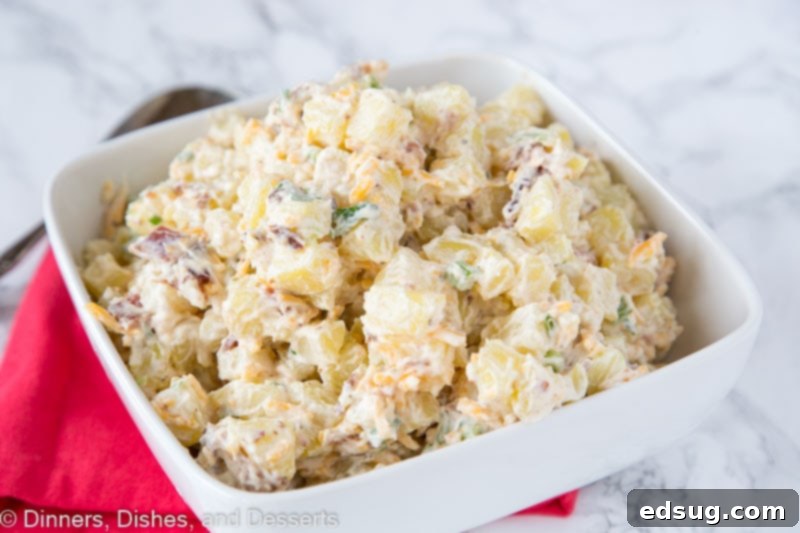 A bowl of food with Potato and Salad