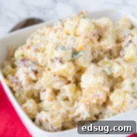 A bowl of food, with Potato and Salad