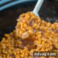 Hearty Homemade Baked Beans 7 A crock pot with baked beans