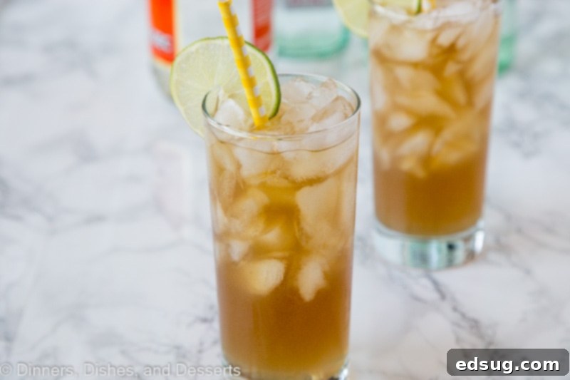 A refreshing Long Island Iced Tea cocktail in a glass, ready to be enjoyed, highlighting its amber color.