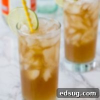 long island iced tea in a glass with a straw