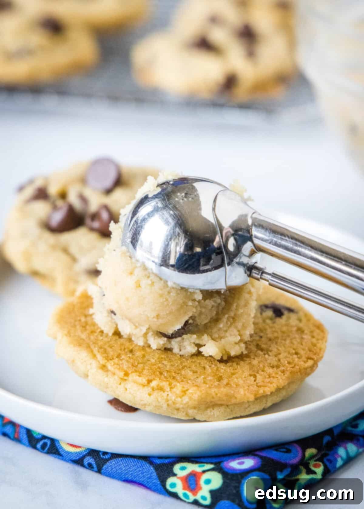 Cookie Dough Sandwich Cookies 2_ scooping edible cookie dough onto a cookie