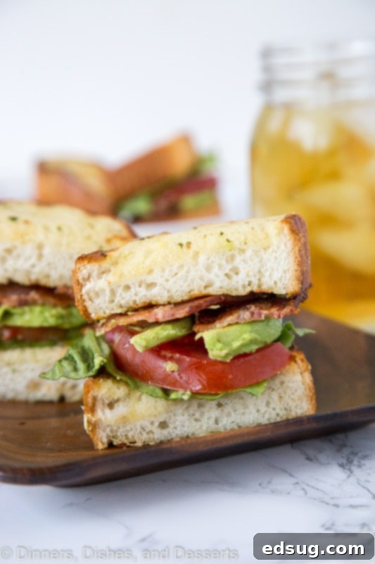 Ultimate Garlic Bread BLT 2 blt sandwich cut in half